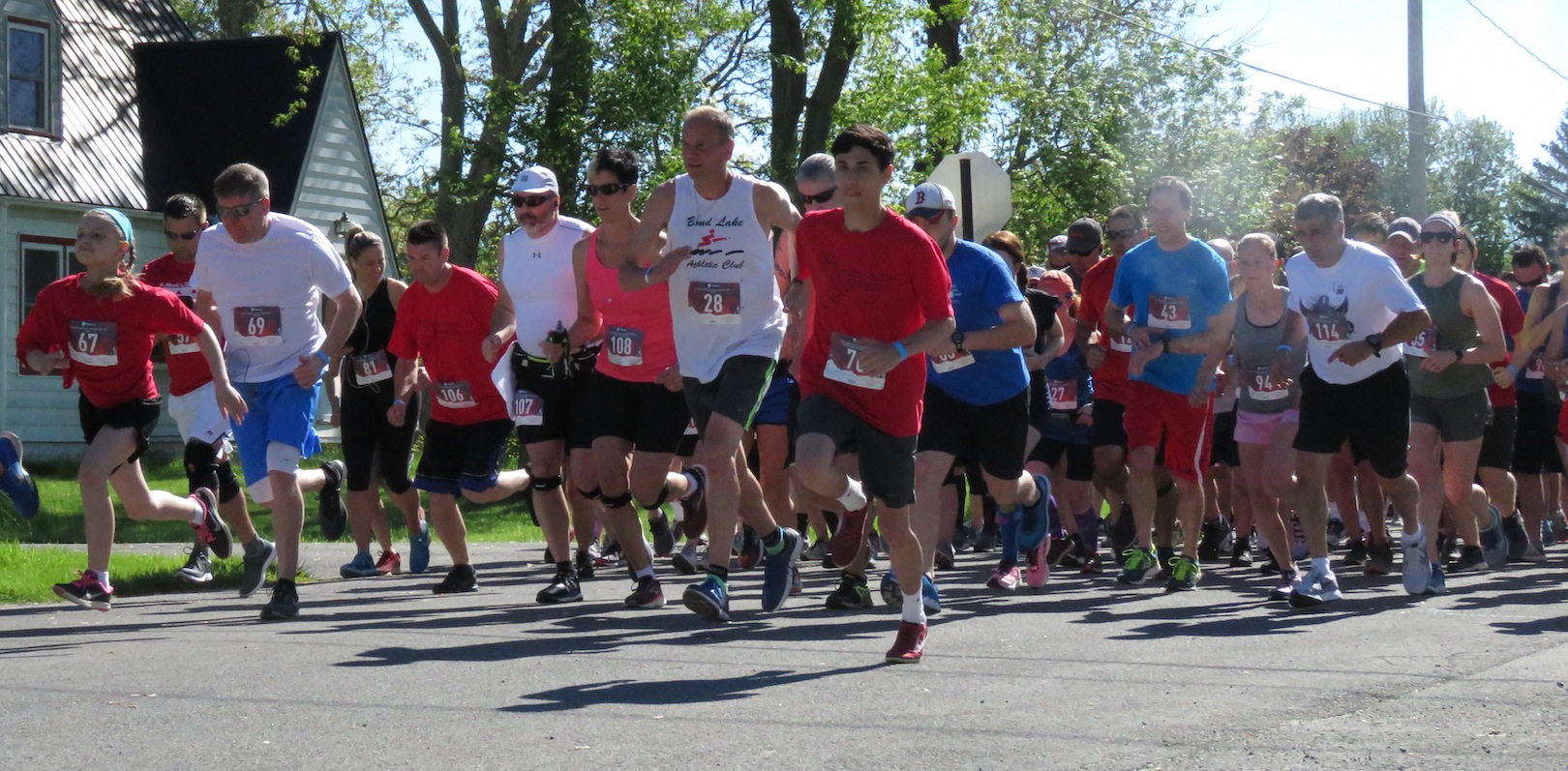 Runners take their first strides during the Bergholz 5K.